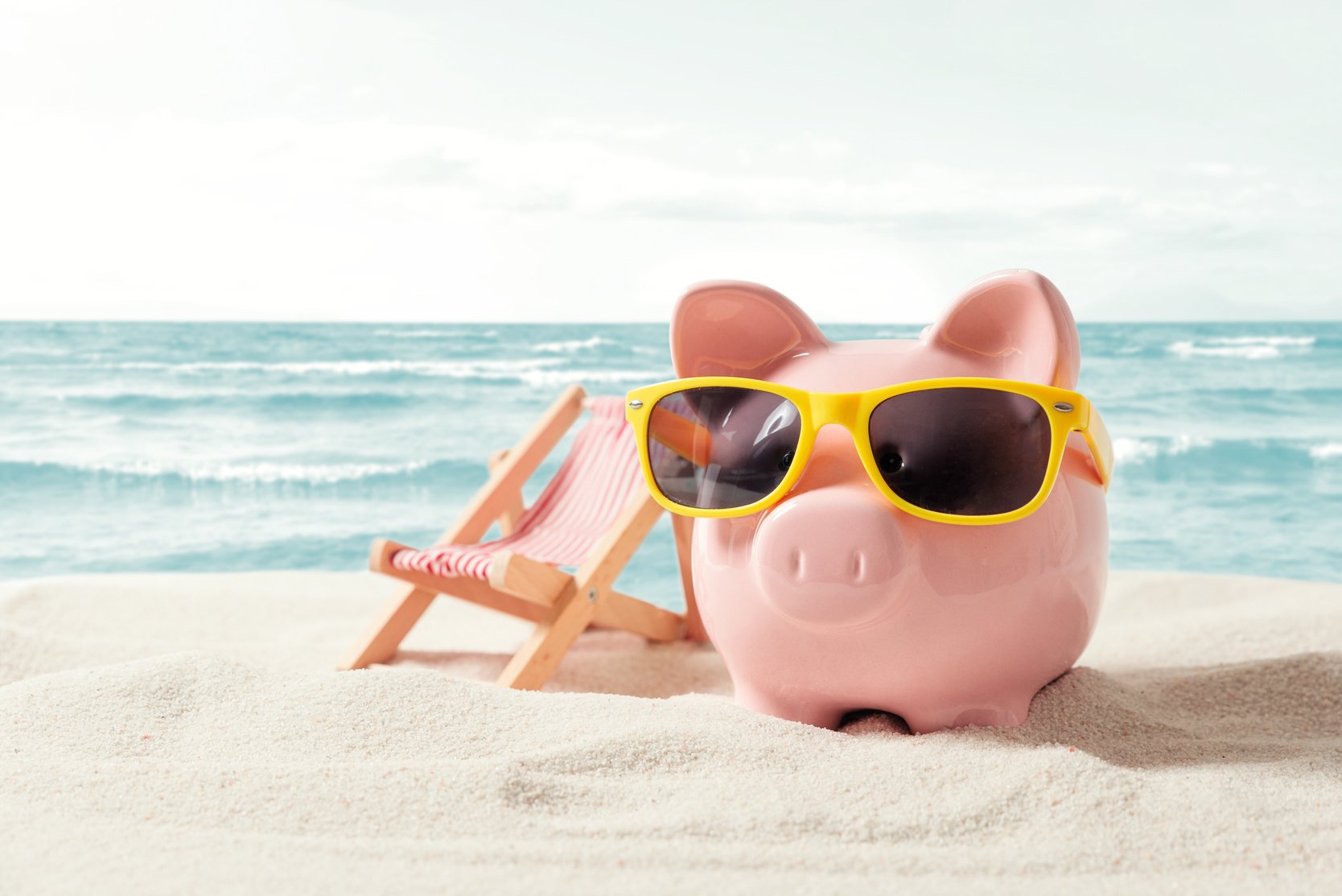 Piggy Bank on Vacation. Finance and Travel Concept