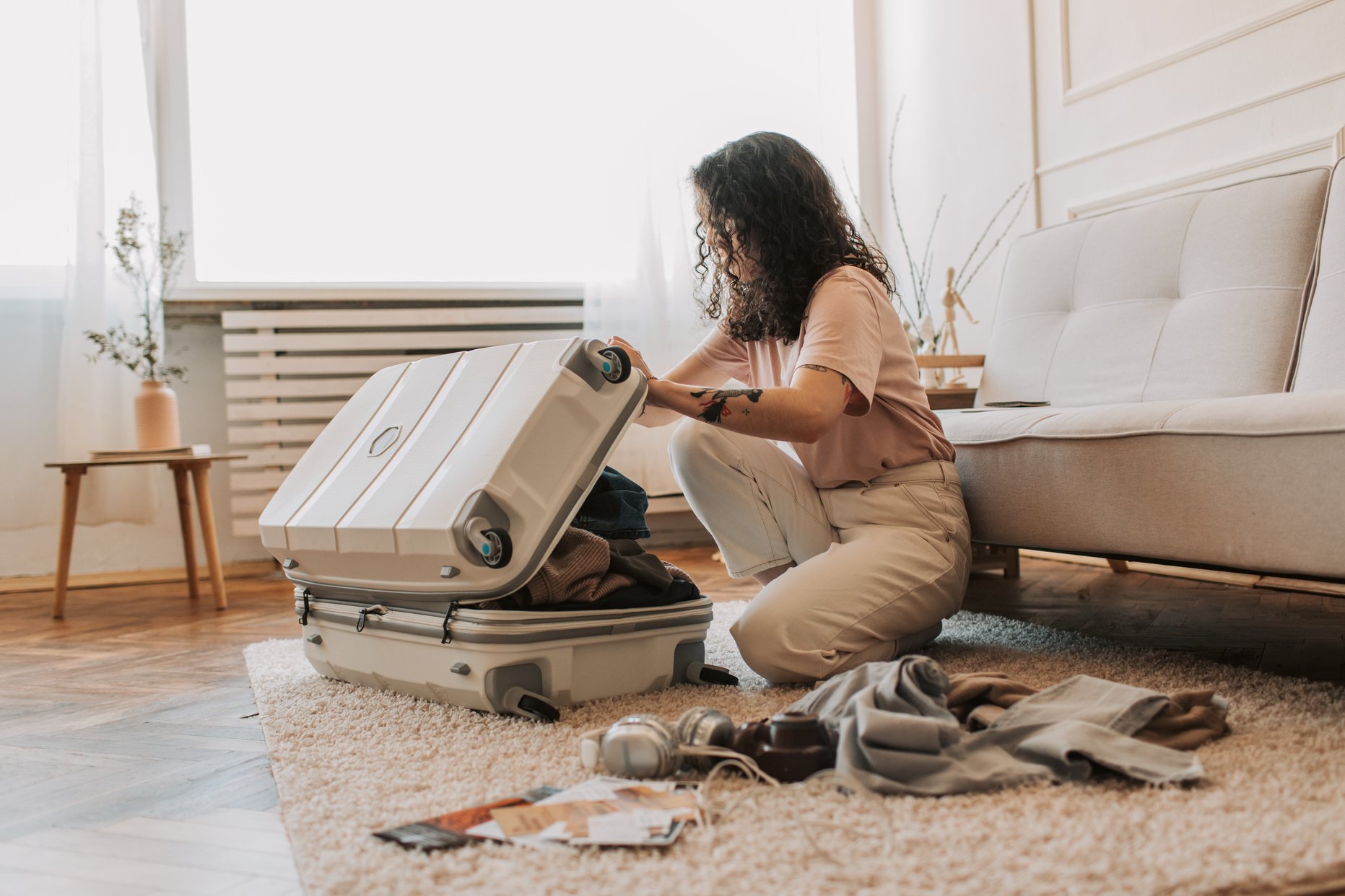 A Woman Packing Her Luggage